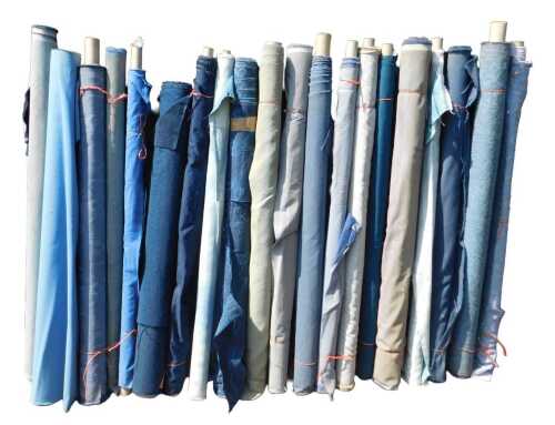 Various bolts of upholstery fabric, differing designs, predominantly blue. (a quantity)