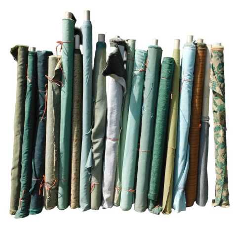 Various bolts of upholstery fabric, differing designs, predominantly green. (a quantity)