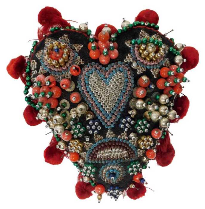 A World War I sweetheart beadwork pin cushion, of heart form, bearing the phrase Success to Our...
