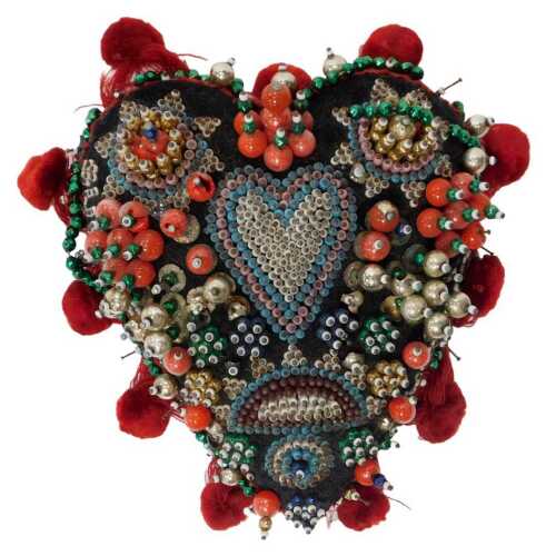 A World War I sweetheart beadwork pin cushion, of heart form, bearing the phrase Success to Our...