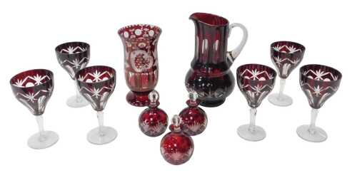 A group of Bohemian ruby flashed glass, comprising six wine glasses, 16cm high, together with a...