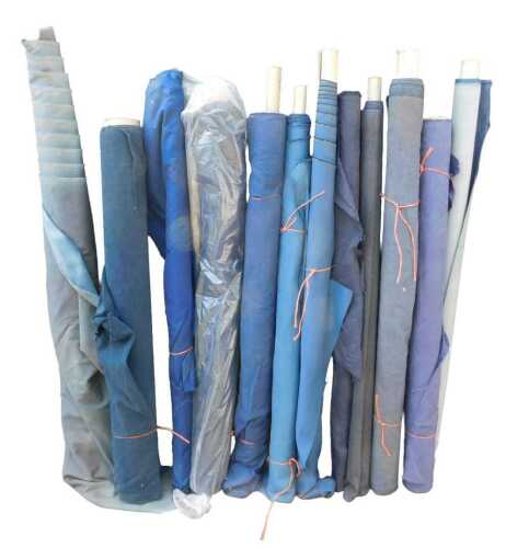 Various bolts of upholstery fabric, differing designs, predominantly blues. (a quantity)