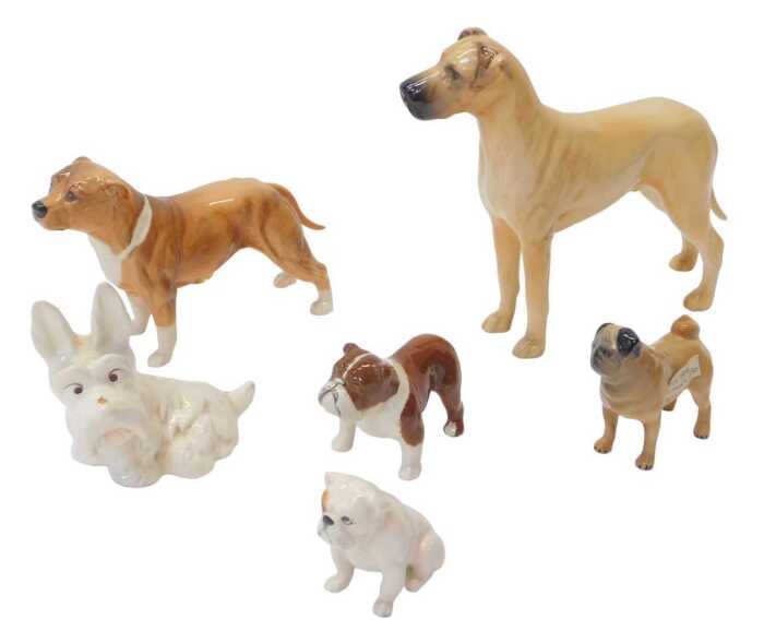 A group of Beswick pottery dog figures, to include CH Ruler of Ouborough, 17cm high, a Pug,...