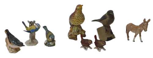 A group of ceramics, to include Beswick pottery birds, a Beswick donkey, (AF), a Poole pottery...