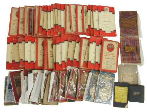 A mixed collection of Ordnance Survey maps, some red, some blue covers, some earlier 20thC OS...