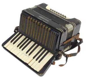 A Hohner Student III piano accordion, with twenty-seven buttons, in black, with a carrying case.