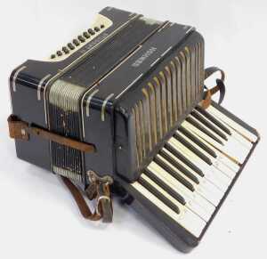 A Hohner Student III piano accordion, with twenty-seven buttons, in black, with a carrying case. - 3