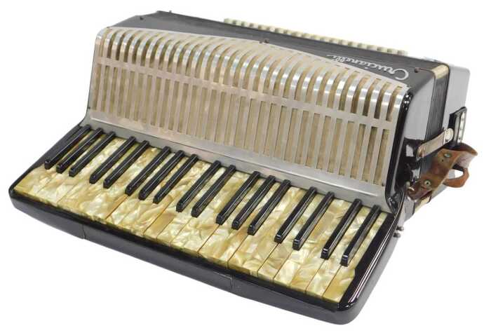 A Crucianelli Italia piano accordion, with one hundred and twenty buttons, in black, with...