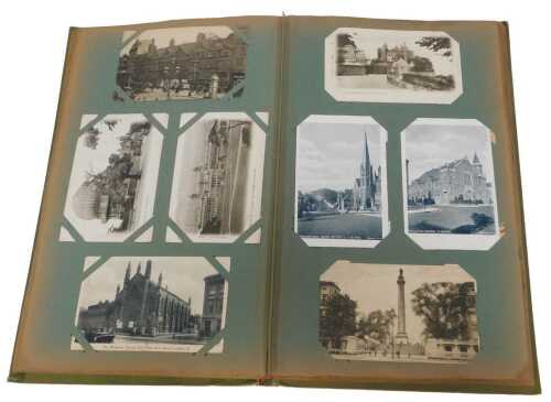 An album of early 20thC postcards, to include real photos, various places to include Manchester,...