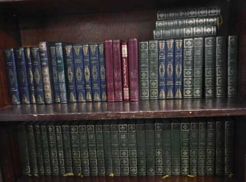 A group of leather bindings distributed by Heron Books, to include works by Charles Dickens,...