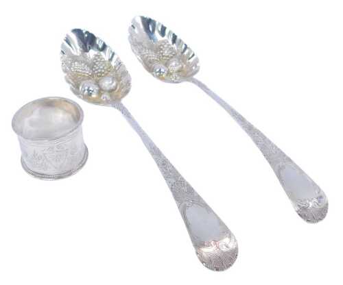 A pair of Victorian silver Old English pattern fruit spoons, with bright cut decorated handles...