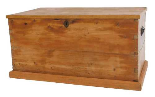 A Victorian pine blanket chest, the hinged lid enclosing a vacant interior with a candle section,...