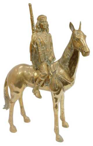 A large scale brass model, depicting a Native American holding a rifle, on horseback, 79cm high.