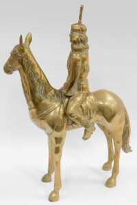 A large scale brass model, depicting a Native American holding a rifle, on horseback, 79cm high. - 2