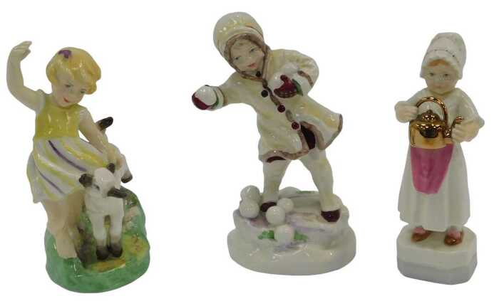 Three Royal Worcester porcelain figures, modelled as April 3416, December 3458, and Polly Put...