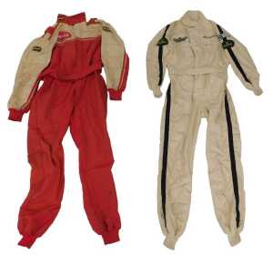 An OMP racing suit and a Jays racing suit, with various applied patches including Dunlop, Rolex...