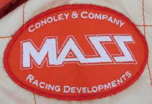An OMP racing suit and a Jays racing suit, with various applied patches including Dunlop, Rolex... - 3