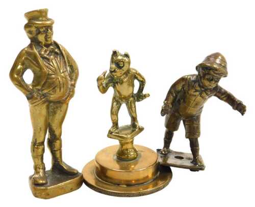 Two vintage brass car mascots and another, comprising standing figure of Corky the Cat on...