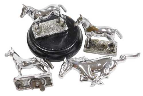 Three Desmo chrome plated car mascots of standing horses, and a Ford Mustang running horse grill...