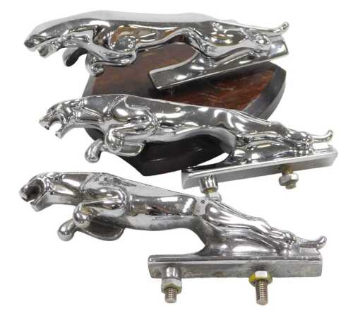 Three chrome plated Jaguar car mascots, each 12cm long, one mounted on shield plinth.
