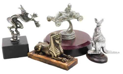 Four car mascots, including a kangaroo with joey, 'Cocking a Snook', Sphinx, and go-cart racer.
