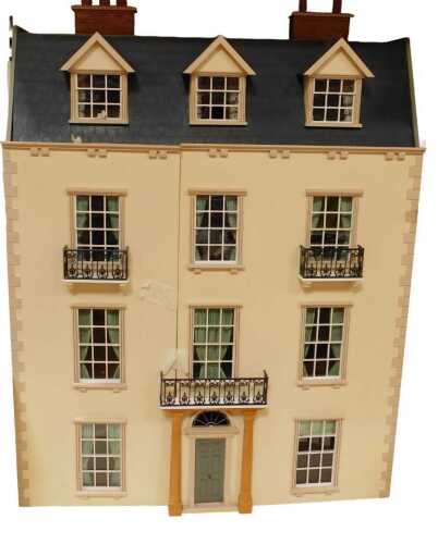 A Georgian style 1:12 scale eight room doll's house, with wired lighting.