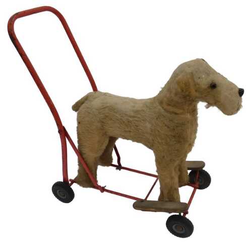 A Tri-ang mohair and cotton push along dog, 60cm high.