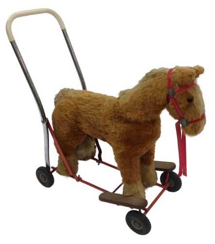 A Tri-ang mohair and cotton push along horse, 61cm high.
