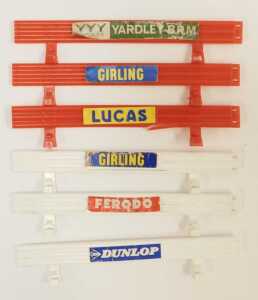A Scalextric A202, BRM racing pit with Dunlop advert, six safety fences with advertising... - 2