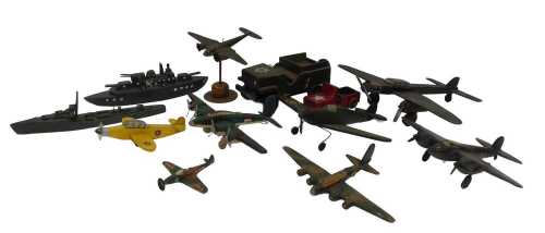 Various wooden aircraft and military vehicles, including a Willys type Jeep, destroyer, fighter...