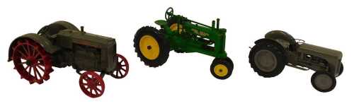 An Ertl Case L tractor, an Ertl John Deere General Purpose tractor, and a Ferguson TEA20 tractor....