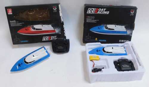 A Hejuan RC boat, and another. (2)