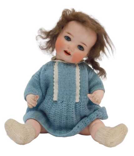 A German bisque headed doll, by Asdorf, with knitted clothing, hat, etc., sleeping eyes.