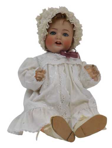 A German bisque headed doll, with sleeping eyes, and cotton clothing, Marked Simon & Halbig.