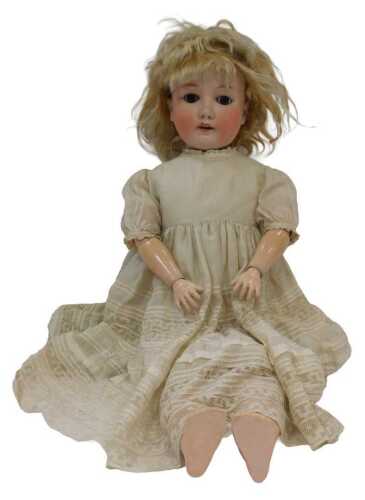 A German bisque headed doll, marked Armand Marseilles No. 200, with articulated body, sleeping eyes, and clothing.