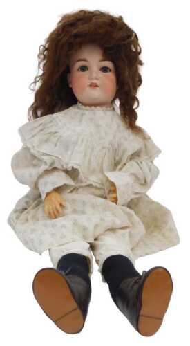 A German bisque headed doll by Armand Marseilles, mark 14, with sleeping eyes, articulated body,...