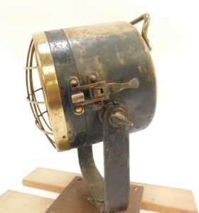 A brass ship's spotlight, mounted on a wooden plinth. - 4