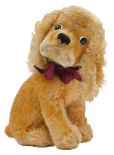 A Steiff Susie Cocker Spaniel plush toy, with button and cloth label to ear, 26cm high.