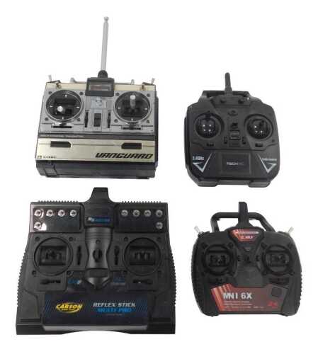 Various RC controllers, including an E Sky MNI6X 2.4ghz controller, Tech RC 2.4ghz controller, a...