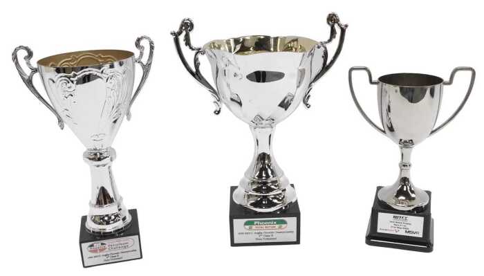 Three silver plated trophies, including Phoenix Total Butler 2000 MGCC Anglia Phoenix...