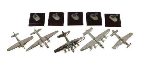 Five diecast aeroplanes, silver coloured metal, each on a stand stamped Legends of the Sky, with...