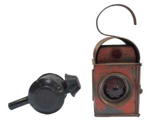 A Kenyons Serilight lens railway lamp, and a buddy lamp with red lens. (2)