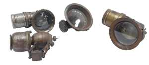 Four carbide lamps, including a Miller carbide lamp, and three others.