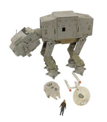 A Star Wars Imperial Walker, a Kenner Millenium Falcon, and a Dinky Star Trek Enterprise. (3)