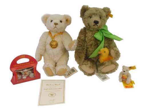 A Steiff Mohair Millennium Bear, 32cm high, with certificate, a Steiff Miniature Original Teddy...