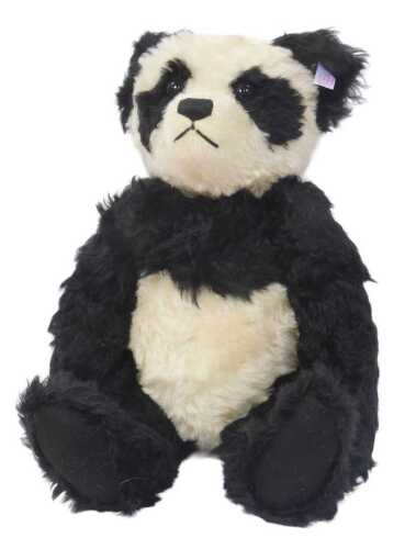 A Steiff Panda bear, black and white mohair, 40cm high, exclusive to the UK and Ireland, limited...