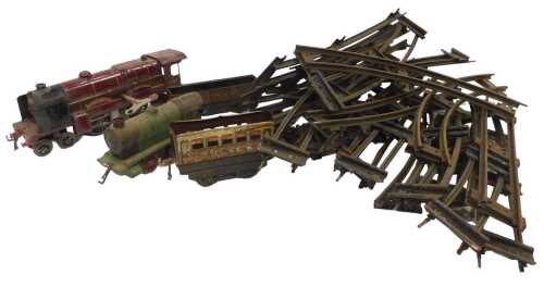 Hornby and other O gauge clockwork tinplate locomotives and track, including a 4-4-2 locomotive...