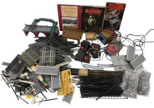 Peco and Hornby OO gauge track and accessories, including a bridge, engine shed, signal box,...