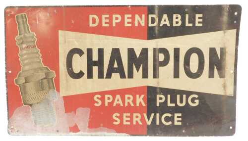 A Champion printed tin spark plug sign.
