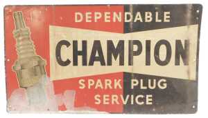 A Champion printed tin spark plug sign.